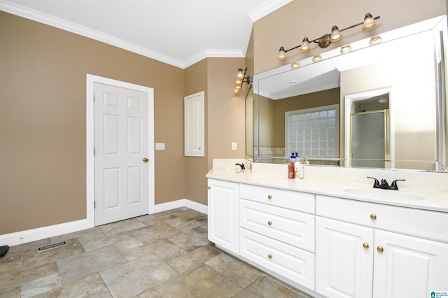 bathroom featuring crown molding, a shower stall, visible vents, a sink, and baseboards