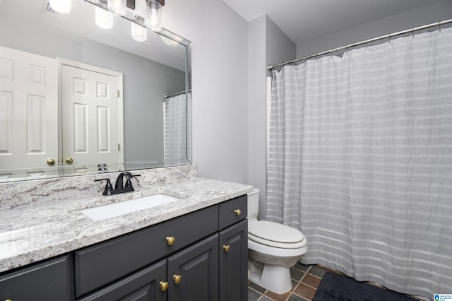 bathroom featuring visible vents, toilet, tile patterned flooring, and vanity