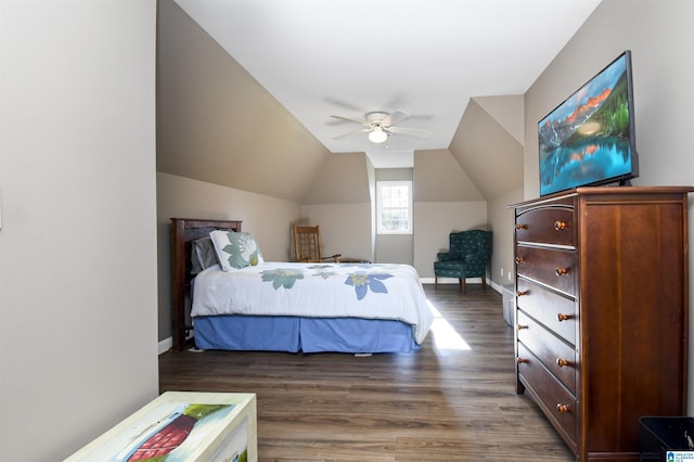 bedroom with baseboards, vaulted ceiling, ceiling fan, and wood finished floors