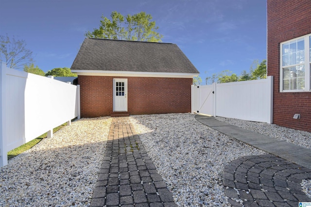 garage with fence and a gate
