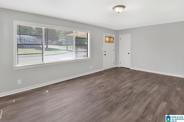 6616 4th Ave S, Birmingham, AL 35212 - spare room featuring visible vents, baseboards, and dark wood finished floors