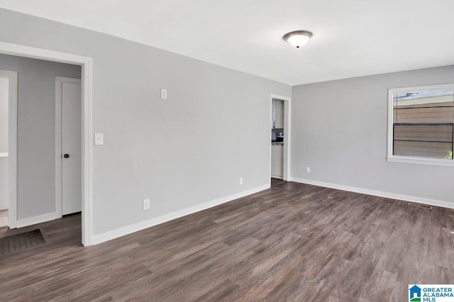 6616 4th Ave S, Birmingham, AL 35212 - spare room featuring visible vents, baseboards, and wood finished floors