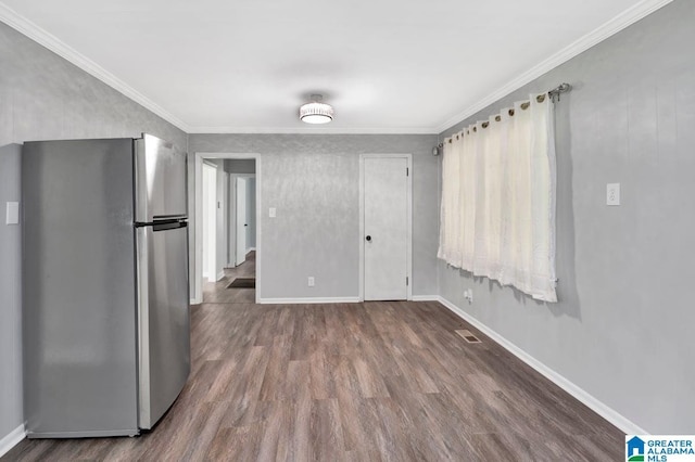 6616 4th Ave S, Birmingham, AL 35212 - unfurnished dining area with visible vents, baseboards, ornamental molding, and wood finished floors