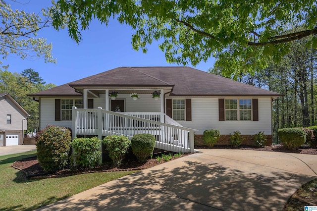 12723 Oak Forest Dr, Lake View, AL 35111 - view of front of property with roof with shingles, covered porch, and concrete driveway