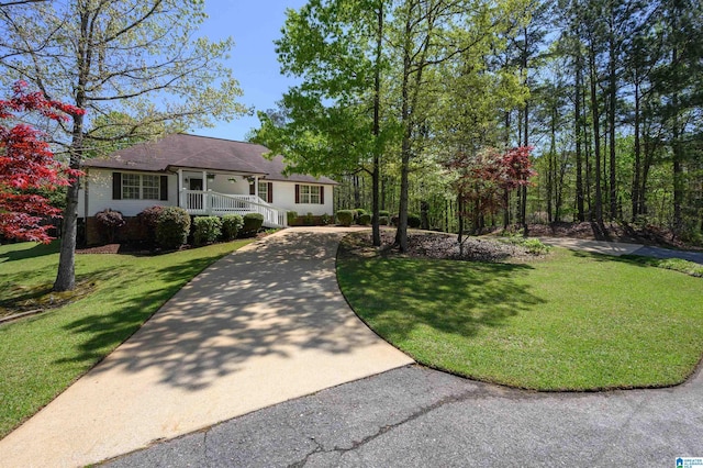 12723 Oak Forest Dr, Lake View, AL 35111 - view of front of property featuring a front lawn, a shingled roof, driveway, and a porch