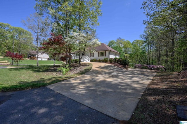 12723 Oak Forest Dr, Lake View, AL 35111 - view of front of house with concrete driveway and a front lawn
