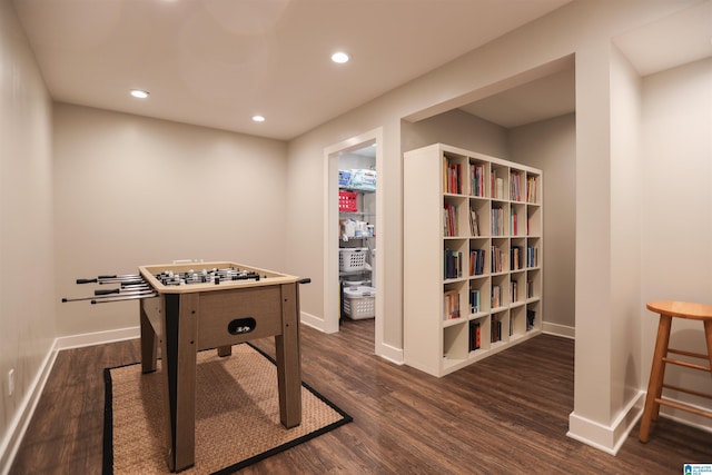 recreation room with recessed lighting, dark wood-style flooring, and baseboards