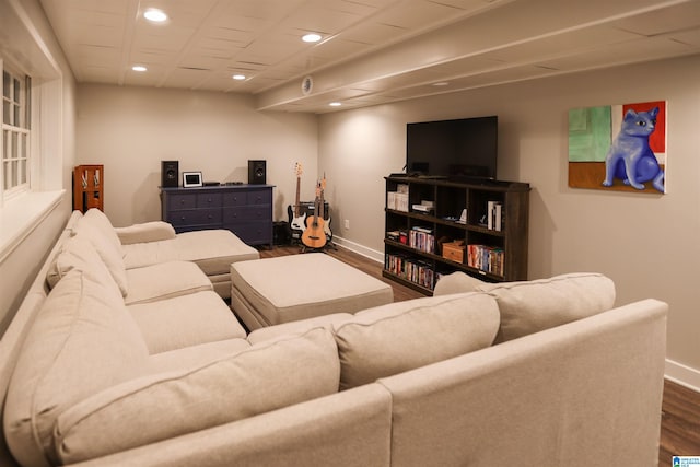 living room featuring baseboards, dark wood-style floors, and recessed lighting