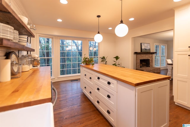 kitchen featuring dark wood-type flooring, white cabinetry, wooden counters, and open shelves