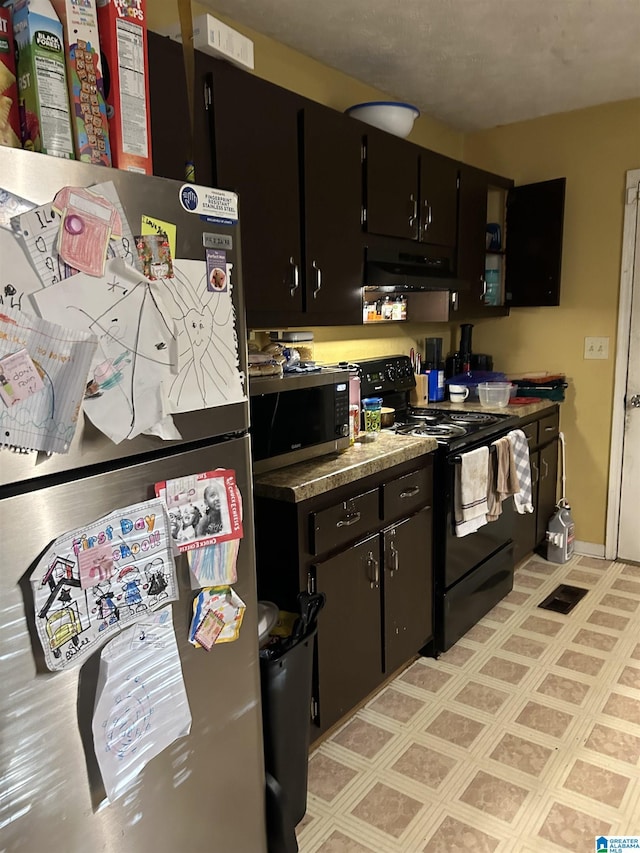 385 Cloverdale Dr, Sylacauga, AL 35150 - kitchen featuring baseboards, appliances with stainless steel finishes, dark cabinetry, and under cabinet range hood