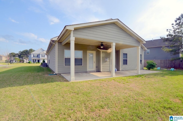 bungalow with a patio area, central air condition unit, a front yard, and ceiling fan