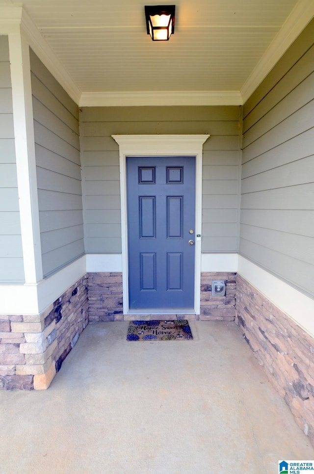 view of exterior entry with stone siding