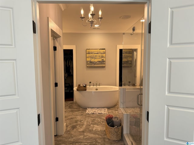 672 Kent Dairy Rd, Alabaster, AL 35007 - full bathroom featuring a spacious closet, a shower stall, a freestanding bath, and an inviting chandelier