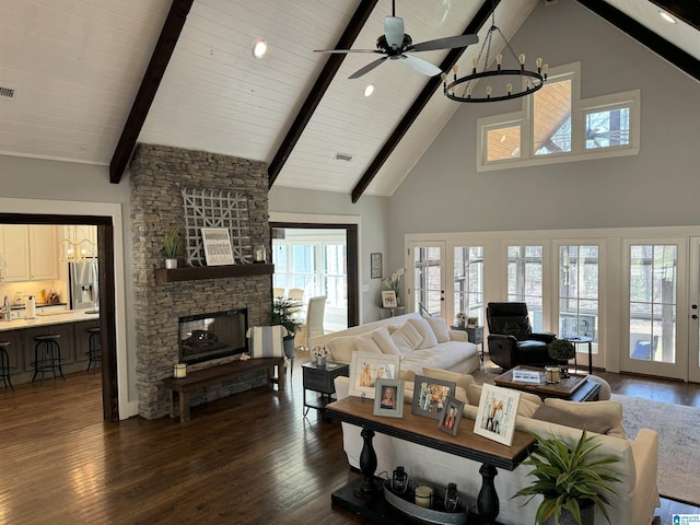 672 Kent Dairy Rd, Alabaster, AL 35007 - living room with high vaulted ceiling, a fireplace, beamed ceiling, and dark wood finished floors