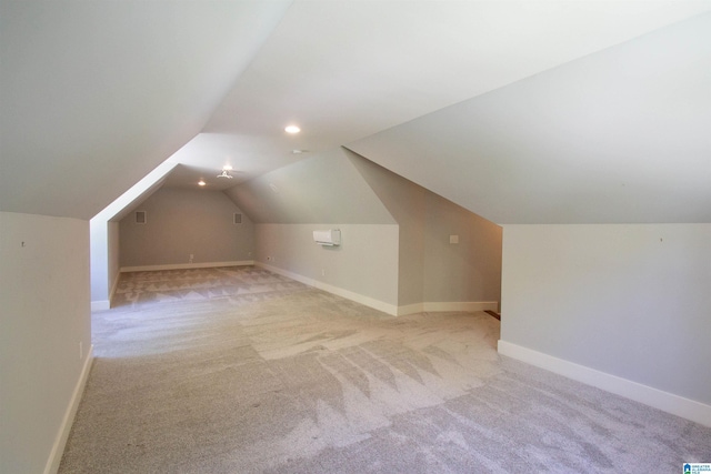 672 Kent Dairy Rd, Alabaster, AL 35007 - additional living space with visible vents, vaulted ceiling, baseboards, and carpet