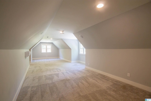 672 Kent Dairy Rd, Alabaster, AL 35007 - additional living space with baseboards, lofted ceiling, and light colored carpet
