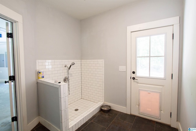 672 Kent Dairy Rd, Alabaster, AL 35007 - mudroom featuring baseboards, dark tile patterned floors, and electric panel