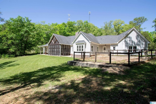 672 Kent Dairy Rd, Alabaster, AL 35007 - back of property featuring a chimney, a sunroom, and a yard