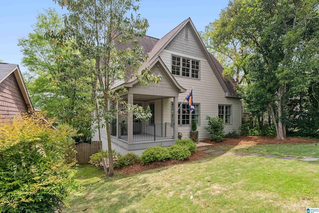 1119 Crest Ave, Homewood, AL 35209 - bungalow-style home with a front yard, fence, and a shingled roof