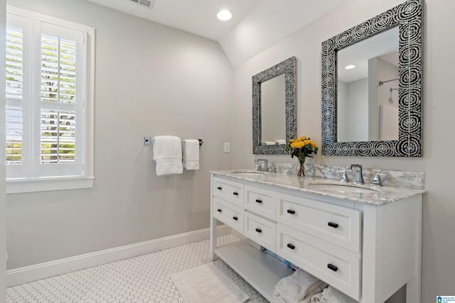1119 Crest Ave, Homewood, AL 35209 - bathroom featuring a sink, baseboards, double vanity, and recessed lighting