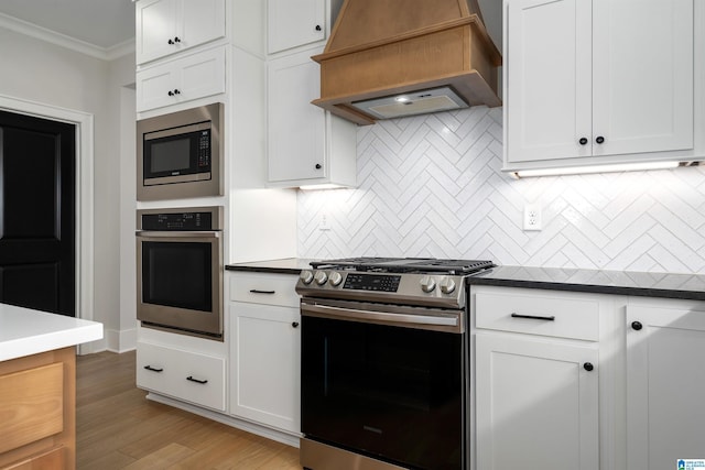 kitchen with stainless steel appliances, custom exhaust hood, tasteful backsplash, and crown molding