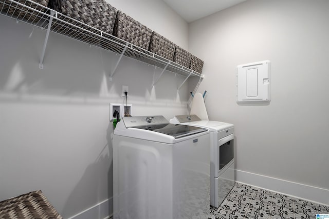 laundry room featuring washer and dryer, laundry area, and baseboards