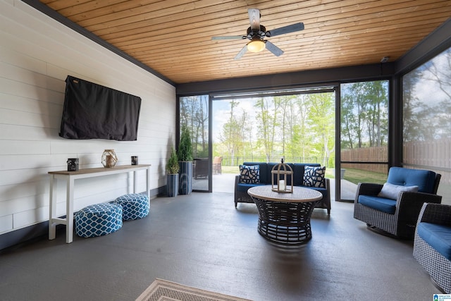 sunroom with outdoor lounge area and a ceiling fan