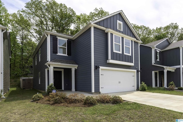 view of front of property featuring board and batten siding, a garage, a front yard, and concrete driveway