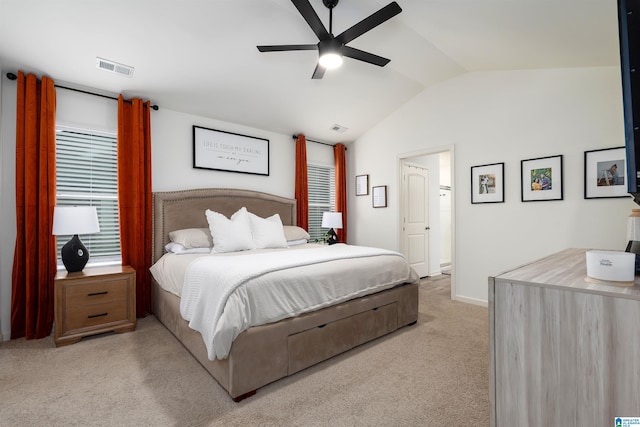 carpeted bedroom featuring baseboards, visible vents, ceiling fan, and lofted ceiling