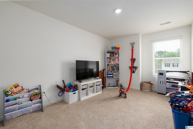 rec room with carpet flooring, baseboards, and visible vents