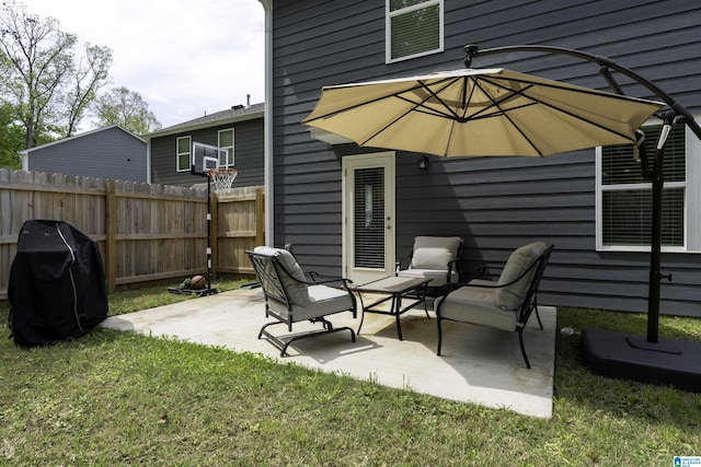 view of patio / terrace with grilling area and fence