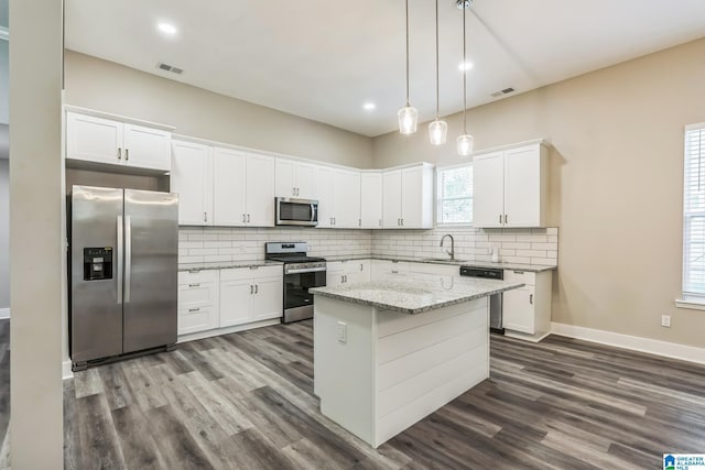 kitchen featuring white cabinets, dark wood-style flooring, visible vents, and stainless steel appliances