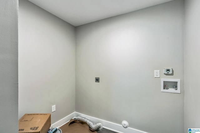 laundry area featuring laundry area, hookup for an electric dryer, washer hookup, and baseboards