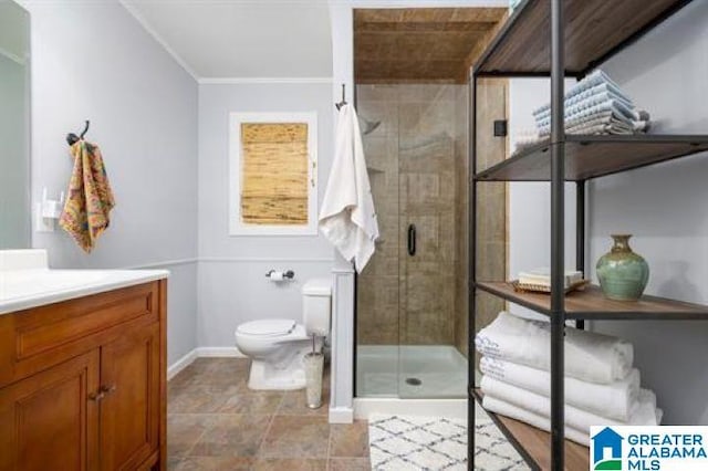 bathroom featuring toilet, a stall shower, vanity, baseboards, and ornamental molding