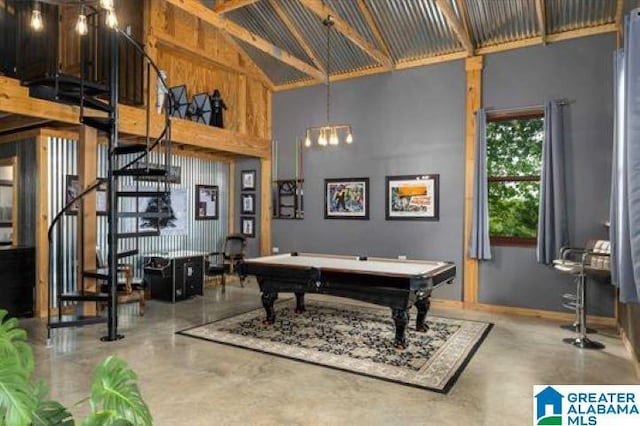 recreation room with baseboards, concrete flooring, high vaulted ceiling, and billiards