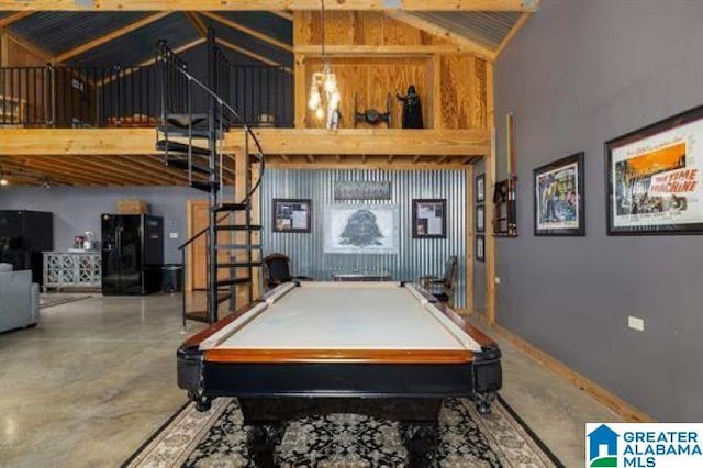 game room featuring high vaulted ceiling, concrete flooring, and pool table