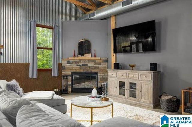 living room featuring visible vents and a fireplace