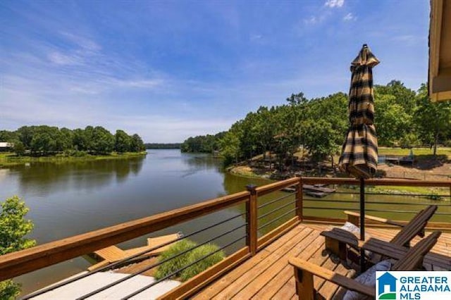 wooden deck featuring a water view
