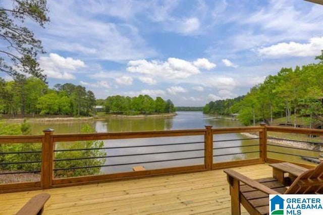 wooden deck with a water view