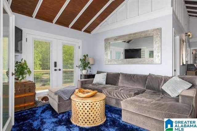 living area with french doors and vaulted ceiling with beams