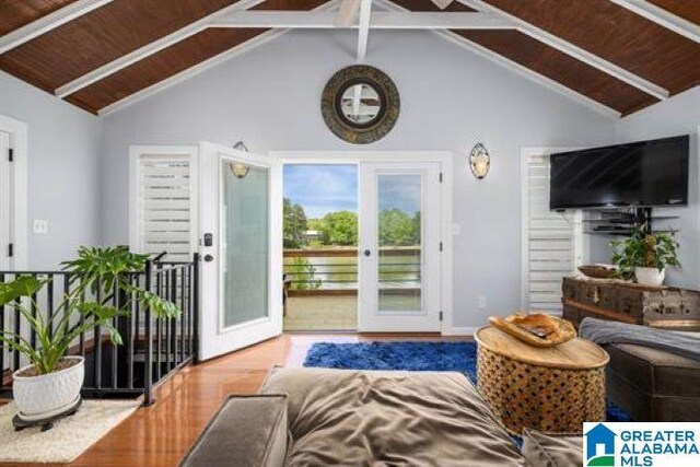 living area with high vaulted ceiling, french doors, wood finished floors, and beamed ceiling