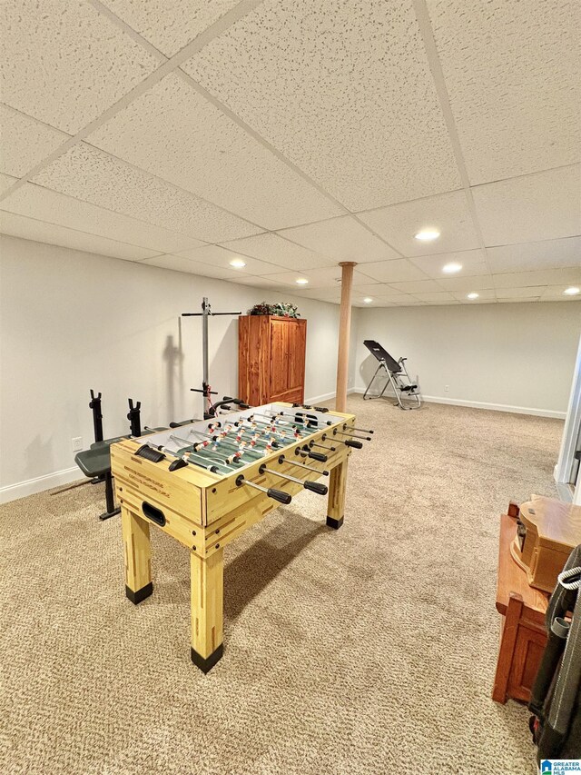 playroom featuring light colored carpet, a drop ceiling, and recessed lighting