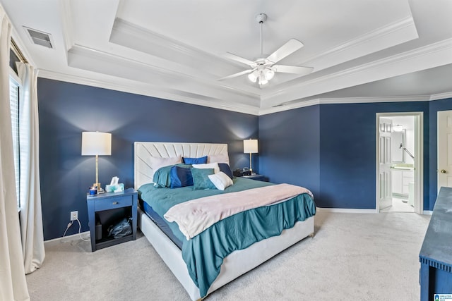 bedroom featuring baseboards, visible vents, carpet floors, and a raised ceiling