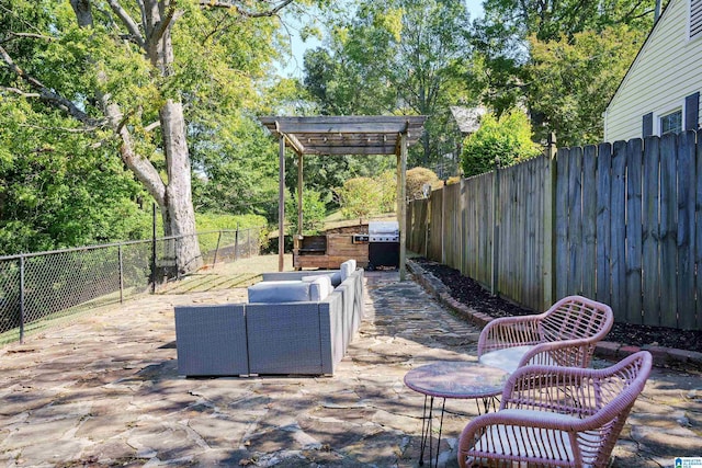 view of patio / terrace with grilling area, a pergola, an outdoor living space, and a fenced backyard