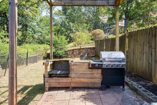 view of patio / terrace with fence and area for grilling