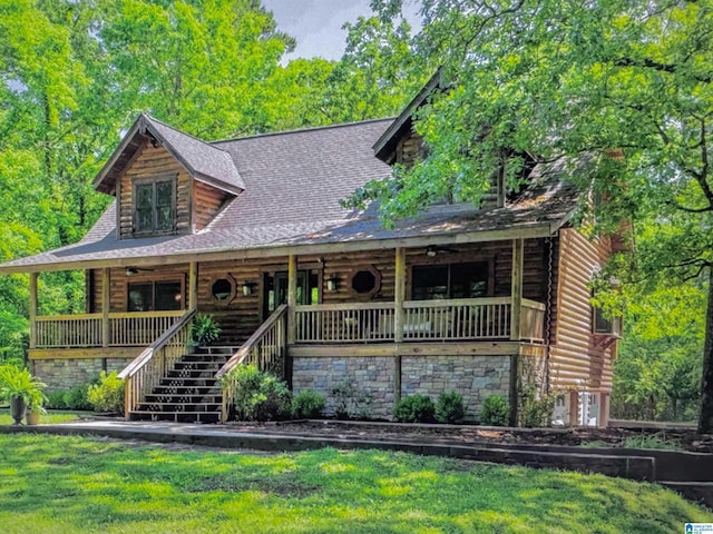 2315 Blackjack Rd, Trussville, AL 35173 - log home with stairs, log exterior, a shingled roof, and covered porch