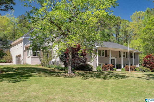 5448 Palomino Trl, Birmingham, AL 35242 - view of front of home with a garage, a front yard, and brick siding