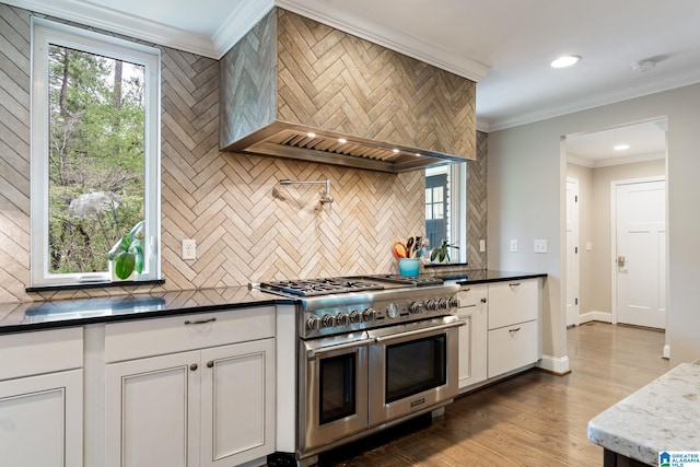 5448 Palomino Trl, Birmingham, AL 35242 - kitchen featuring white cabinetry, recessed lighting, custom range hood, decorative backsplash, and range with two ovens