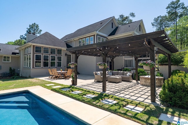 5448 Palomino Trl, Birmingham, AL 35242 - back of property featuring a pergola, central AC, outdoor lounge area, a patio, and an outdoor pool