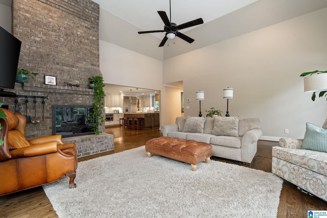 5448 Palomino Trl, Birmingham, AL 35242 - living area with wood finished floors, high vaulted ceiling, baseboards, and a ceiling fan